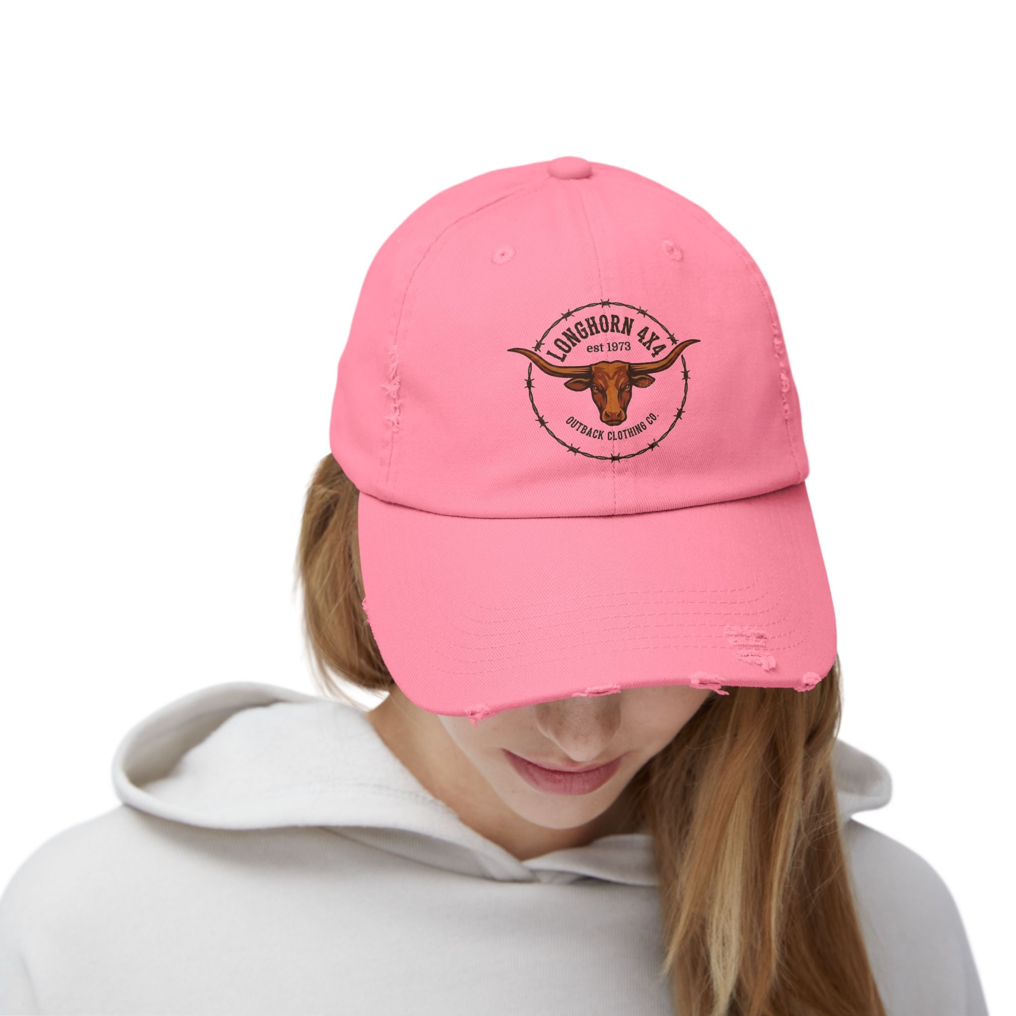 Person wearing a pink cap with a logo on a white background