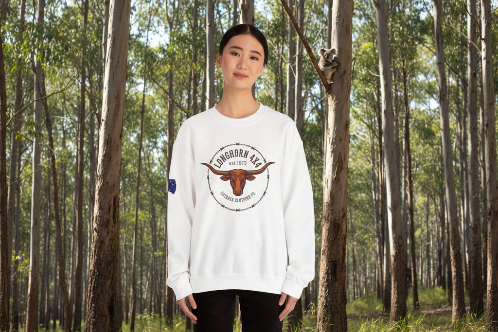 Person wearing a white sweatshirt with a longhorn 4x4 logo in a eucalyptus forest and a koala in the background.