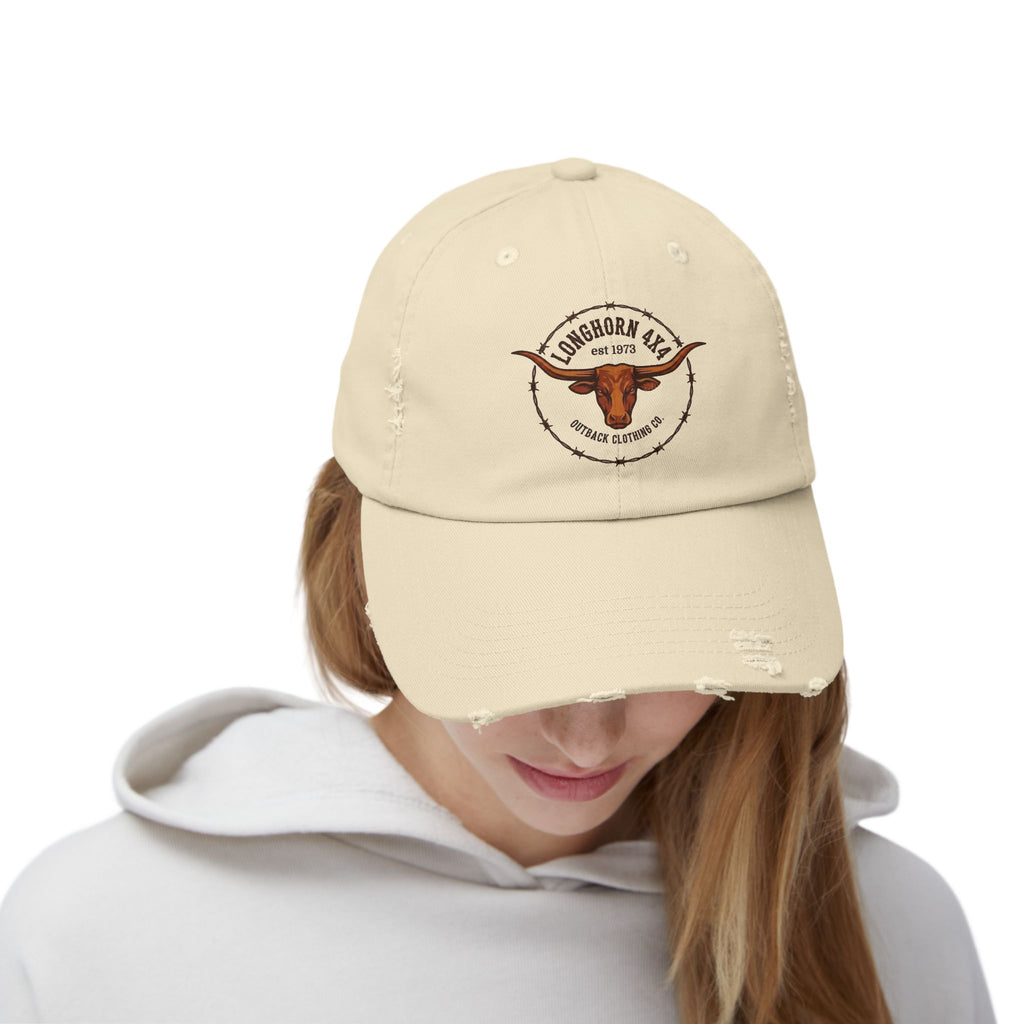 Beige cap with logo worn by a person on a white background