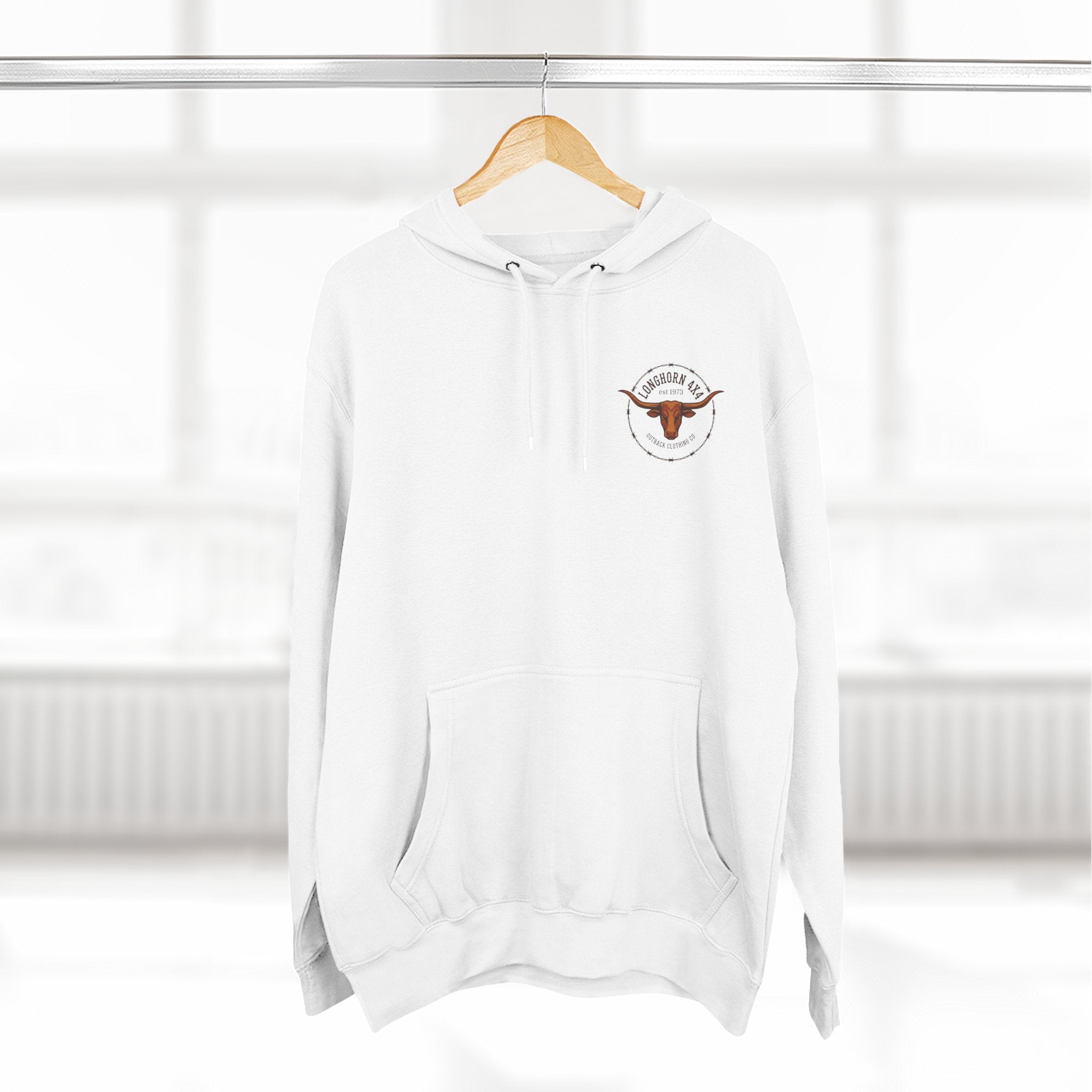 White hoodie with a logo on a wooden hanger against a white background
