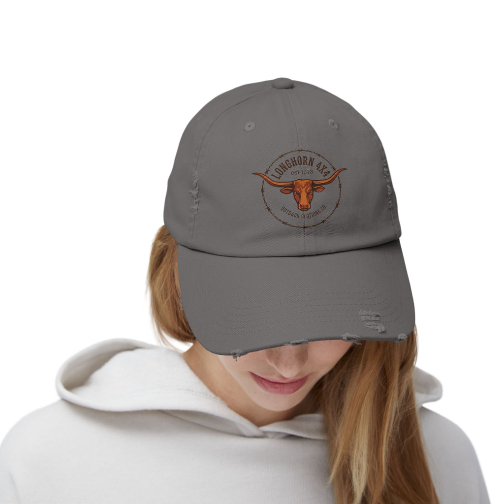 Person wearing a gray cap with a logo on a white background