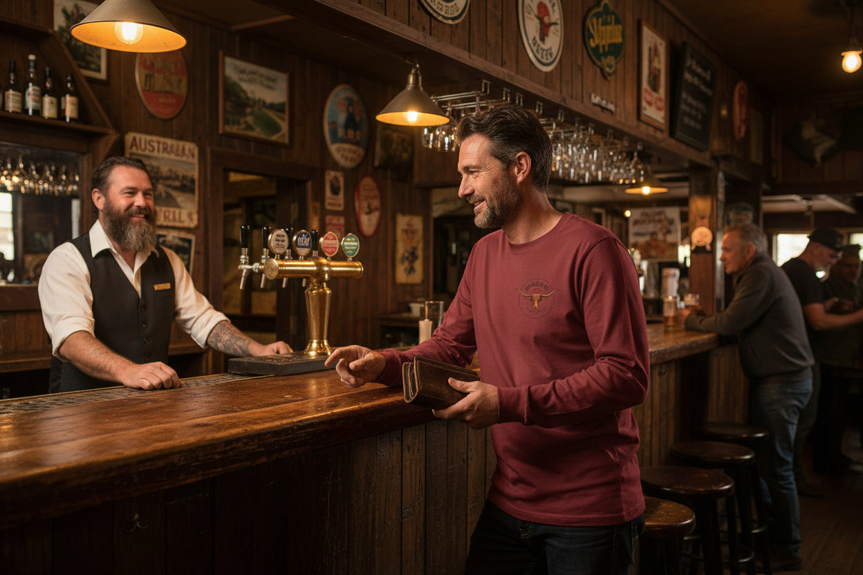 Maroon long-sleeve shirt with a logo on in an outback pub background